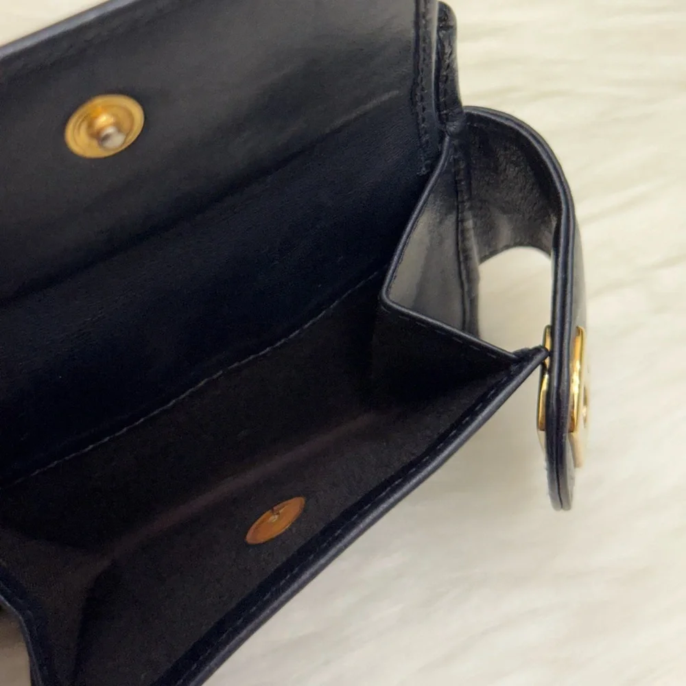 SALVATORE FERRAGAMO - BLACK LEATHER GOLD PLATED SECURE CLOSURE BIFOLD WALLET